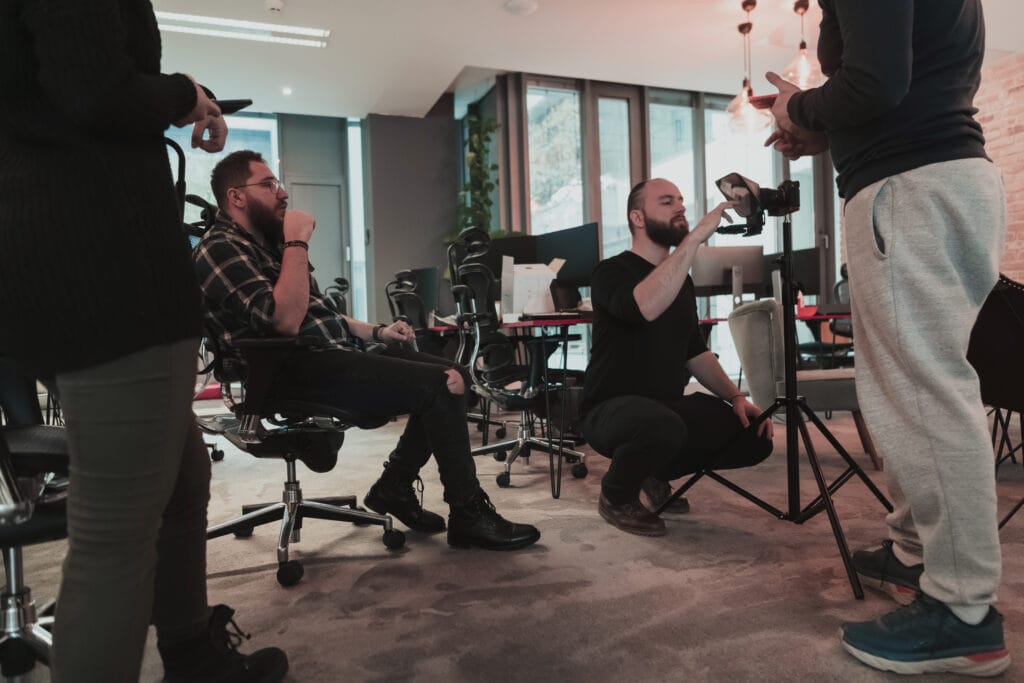 a group of young producers discuss the project before filming begins. selective focus a group of young producers discuss the project before filming begins. selective focus