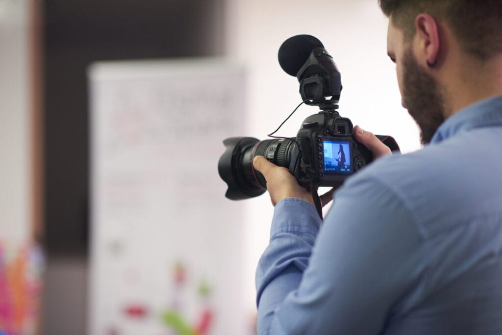 videographer recording on conference videographer recording on conference